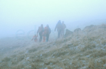 Comp image : ld01213 : A family descends though thick mist after a day's fell walking in the English Lake District
