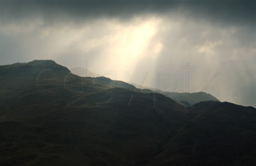 Comp image : ld02222 : Heavy cloud and winter sunbeams over dark Lake District fells near Patterdale, seen from Place Fell