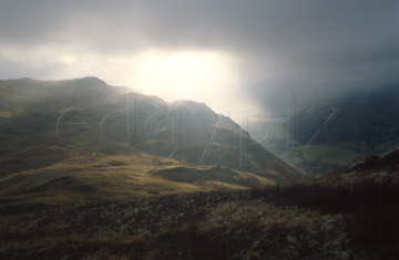 Comp image : ld02223 : Sun breaking through heavy cloud over Brothers Water and dark Lake District fells near Patterdale