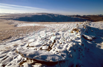 Comp image : ld02417 : Snow covers a stone wall on High Street, east of Hartsop, in the English Lake District. Thornethwaite Crag under a blue sky in the distance.