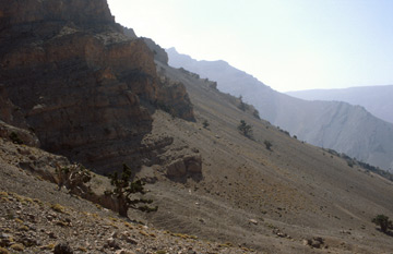 Comp image : mgun1323 : Strong sun shining on scree and barren landscape in the High Atlas mountains of Morocco