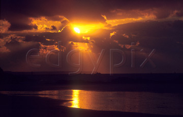 Comp image : sky0105 : Dramatic orange sunset lighting up the clouds, and its reflection in the wet sea shore at low tide