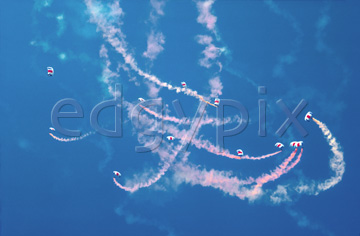 Comp image : sky0121 : Looking up at the smoke trails of a parachute display team against a pure blue sky