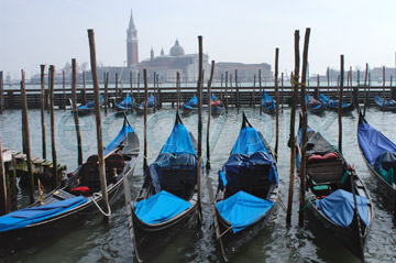 Comp image : ven021370 : Gondolas with blue covers moored near the Piazzetta San Marco in Venice, Italy, with Chiesa di San Giorgio Maggiore in the distance