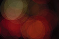 Subdued abstract photo with overlapping red, orange and white translucent circles