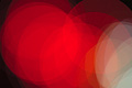 Bright abstract photo with overlapping red and white translucent circles