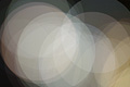 Bright abstract photo with overlapping white and cream translucent circles
