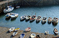 Looking down on fishing boats in the small harbour at Clovelly, Devon, England
