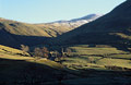 Thornthwaite Crag from Hartsop, in the English Lake District. Snow on the Crag, and strong winter sun.
