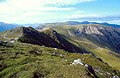 Looking NW from Dale Head to Hindscarth, in the English Lake District, in autumn sunshine under a blue sky with light cloud, with the peak of Robinson in the distance