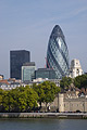 Buildings old and new: Sir Norman Foster's 'gherkin' and the historic Tower of London seen from the south bank of the River Thames in London, England