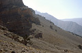 Strong sun shining on scree and barren landscape in the High Atlas mountains of Morocco