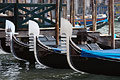 Bow 'flags' (ferri) of gondolas moored on the Grand Canal in Venice, Italy. The six projections of the ferro symbolise the six districts (sestieri) of the city.