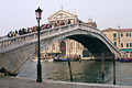 Crowds of people crossing the Ponte Degli Scalzi bridge over the Grand Canal [Canal Grande] in Venice, Italy