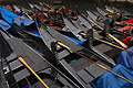 Strong pattern composition of closely packed black gondolas moored on a canal in Venice, Italy
